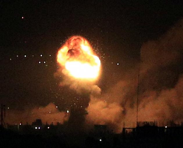Smoke and flames rise during Israeli airstrikes in Gaza on Friday. Photo: Reuters
