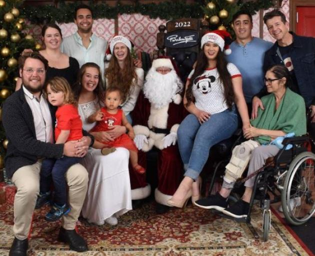 Simon and Jodi Barnett (far right) in a photo taken last Christmas at Ballantynes, Christchurch,...