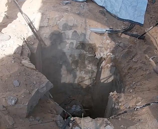 The entrance to what Israel's military says is the shaft of a Hamas underground tunnel uncovered...