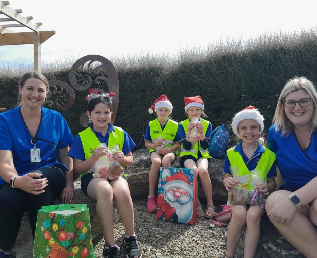 Ready to receive some donated baking are Clyde Hospital’s Vincent ward charge nurse (left) Gemma...