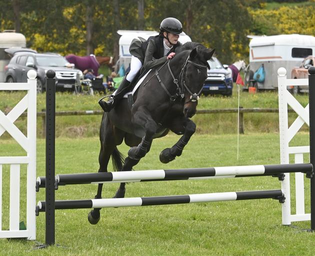 Imogen Leaper, 14, of the Dunedin Pony Club, competes in the showjumping phase of the Oskam...