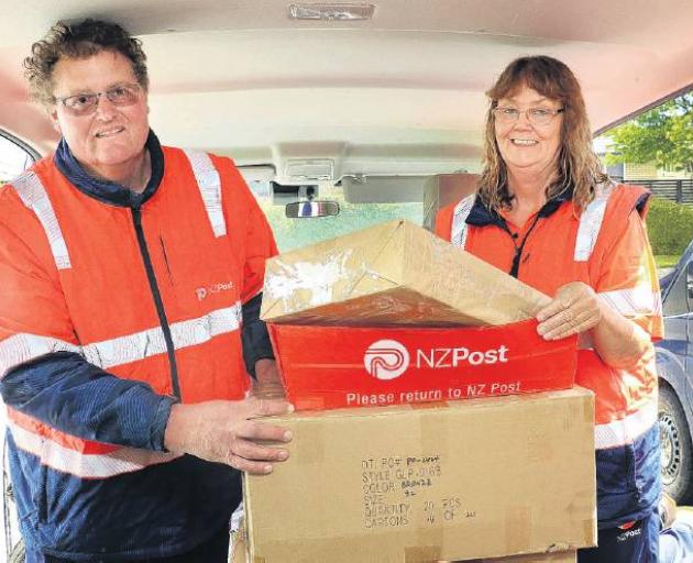 Rural Delivery contractors Jeff Pawsey, and Pam Bint of Rangiora, begin to load another van full...