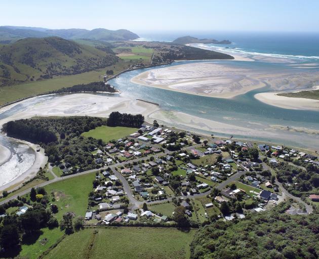 The popular seaside town of Pounawea lies between the Owaka river (left) and the Catlins river...