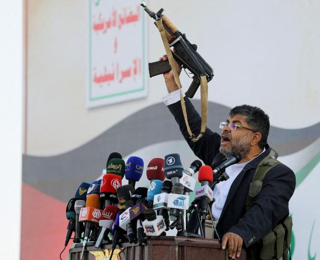Mohammed Ali al-Houthi, a member of the Houthi supreme political council, speaks as supporters...