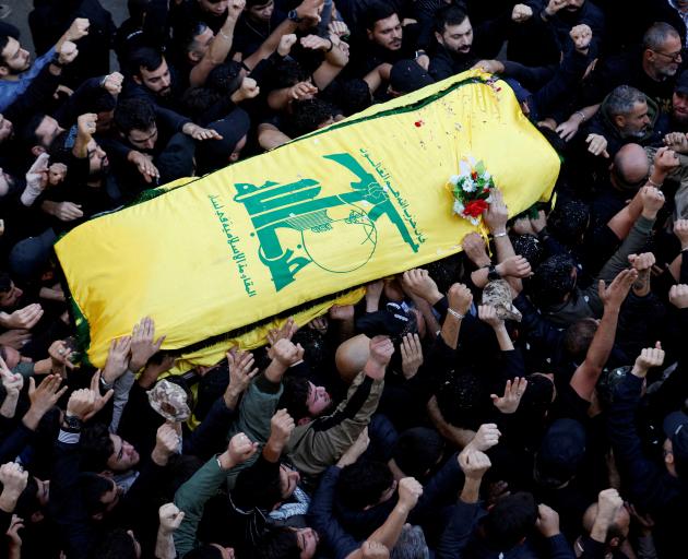 People carry the coffin of Hezbollah member Abbas Raad, senior Hezbollah figure and member of...