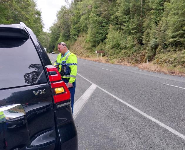 Sergeant Dave Leach stops yet another day tripper on the Milford Road. PHOTO: MARY WILLIAMS