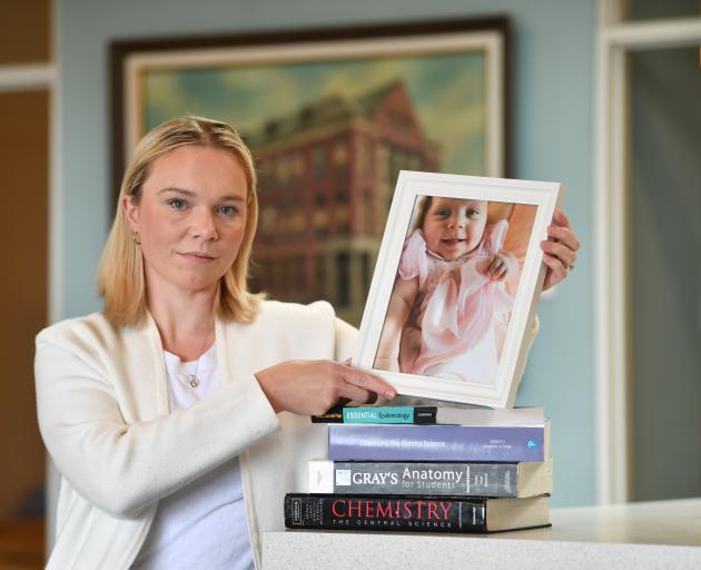 Sally Aldrich with a photograph of Claire. Photo: Stephen Jaquiery