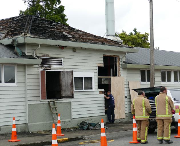 Fire inspectors assess the damage to Balclutha Primary School’s boiler room following a fire...