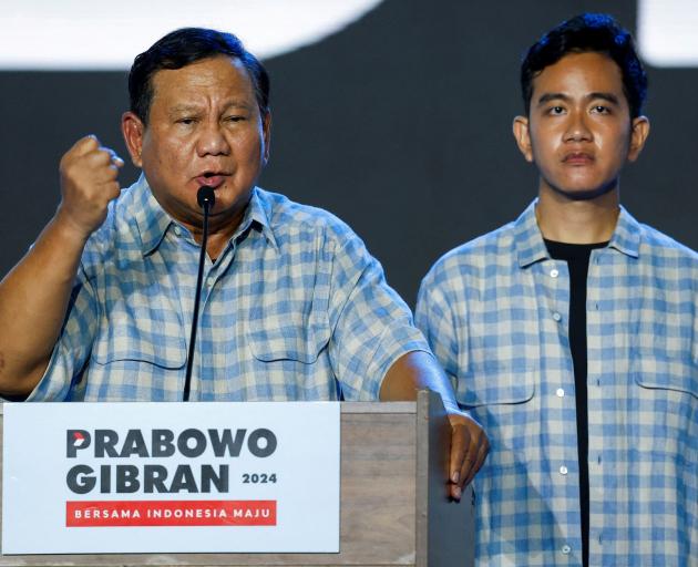 Indonesia’s president Prabowo Subianto delivers a speech as running mate Gibran Rakabuming Raka...