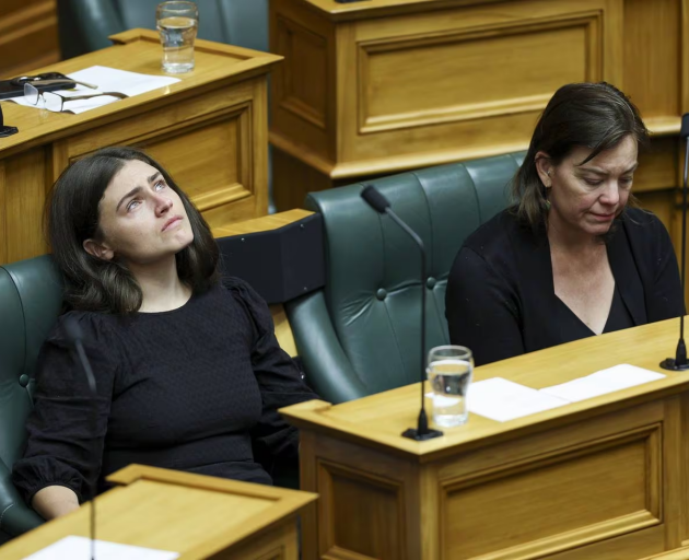 Green MPs Chloe Swarbrick and Julie Anne Genter look on during to a tribute to Efeso Collins at...