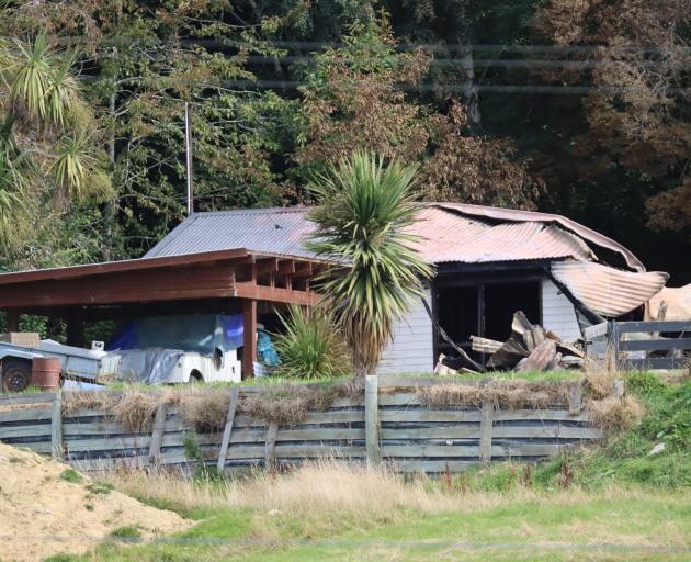 All that remains of a suspicious house fire in Waikaia is part of the garage and a lean-to which...