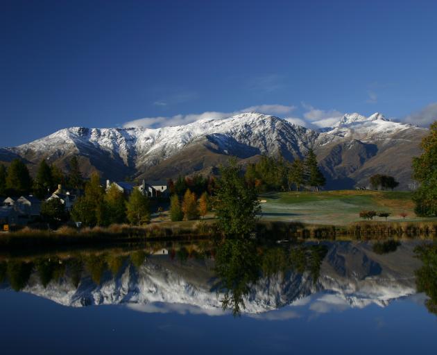 The Remarkables reflected in one of the ponds at Millbrook Golf Resort. Photo: Getty Images 