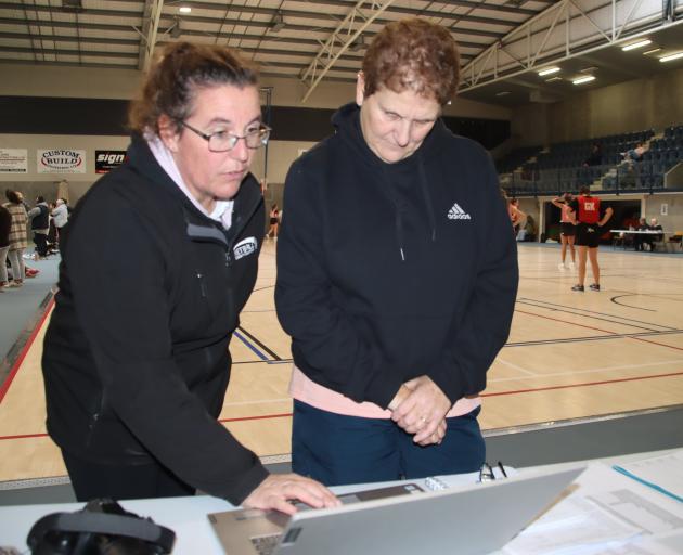 Netball Eastern Southland president Belinda Knapp (left) and draw convener Alison Cormack discuss...