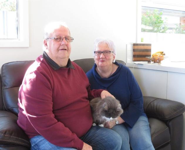 Judy and husband Dennis with Millie the cat. Photo: Supplied