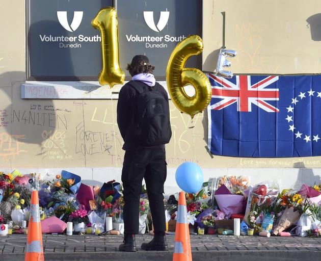 Flowers lie where Enere McLaren-Taana was fatally stabbed at the Dunedin bus hub. PHOTO: PETER...