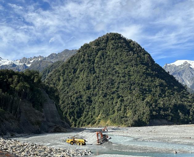 Gravel buildup in the Waiho River-bed beside Franz Josef township being managed by contractors....