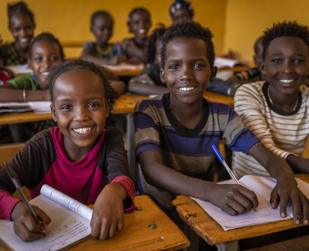 Children enthusiastically wait for school to start in their isolated village in southern Ethiopia...