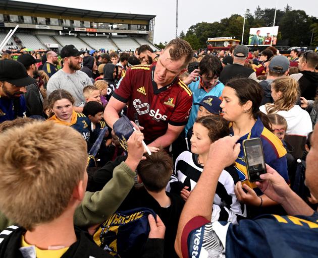 Highlanders and Southland lock Josh Bekhuis signs autographs after a Highlanders game at Rugby...