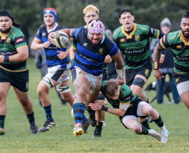 Blues player  Tupou Kaufononga slips a tackle during a Southland premier grade match against...