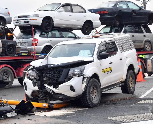 Hundreds of motorists and a train were delayed after a vehicle crashed into a traffic light,...