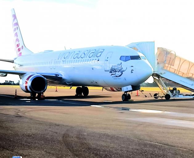 The Virgin Australia Boeing 737-8FE plane, hit by a suspected bird strike on Monday, sits at...