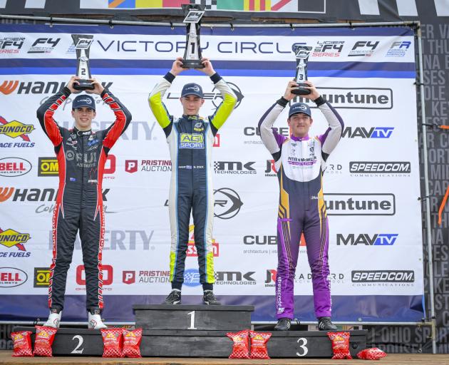 Alex Crosbie (right), of Invercargill,  on the podium after finishing third in his Crosslink/Kiwi...