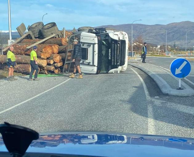 A logging truck rolled at the entrance to Cromwell, blocking a lane and causing traffic troubles....