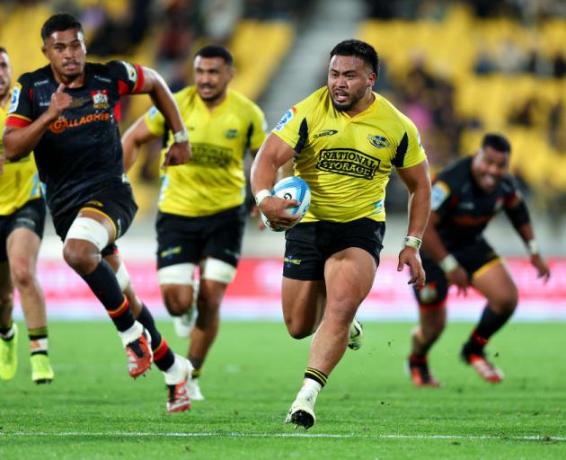 Hurricanes hooker Asafo Aumua makes a break