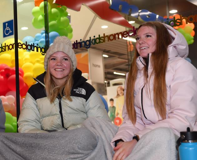 Benka Page-Smith (left) and Ariella Lucas eagerly await the opening of Kmart 
...