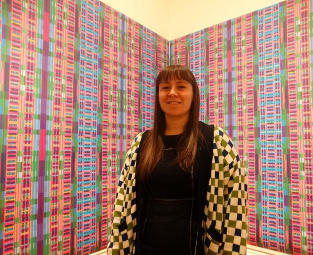 The new Forrester Gallery curator Anna McLean stands in front of Oamaru artist Maggie Covell’s...