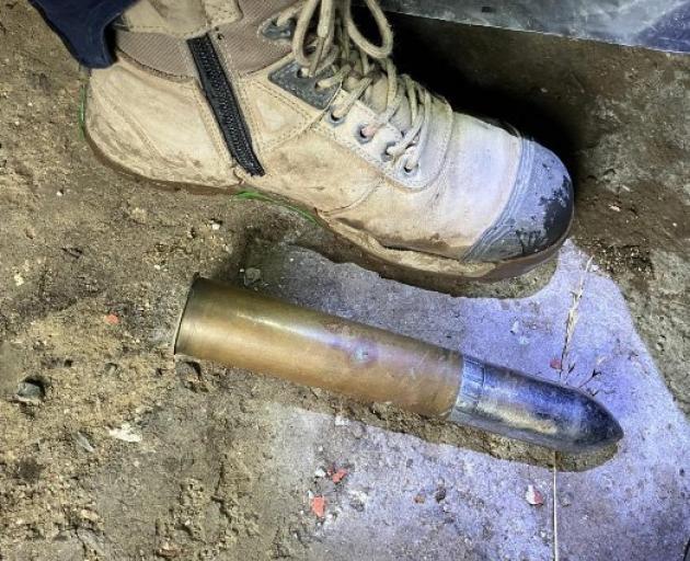An undetonated shell discovered under a property by a resident in Corstorphine Rd. PHOTO: NZ POLICE