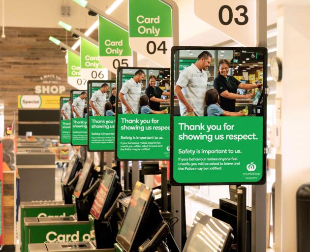 Posters in a Woolworths supermarket asking customers to treat staff with respect. PHOTO: SUPPLIED