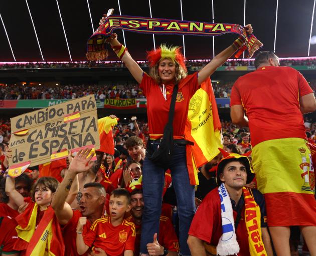 Spanish fans celebrate their side's semifinal win over France in Munich. Photo: Reuters 