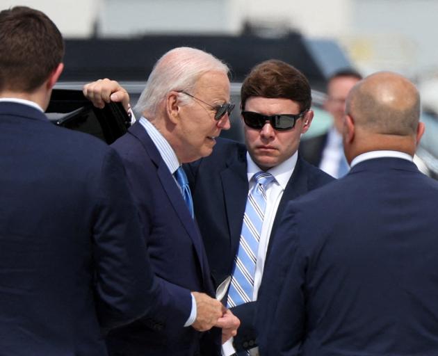 US President Joe Biden walks toward Air Force One, at Harry Reid international airport in Las...