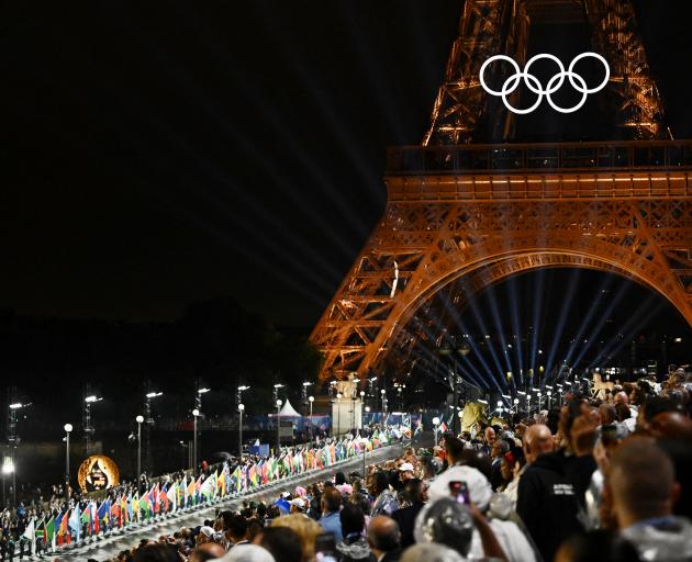 The Olympic rings lit up on the Eiffel Tower. Photo: Reuters 

