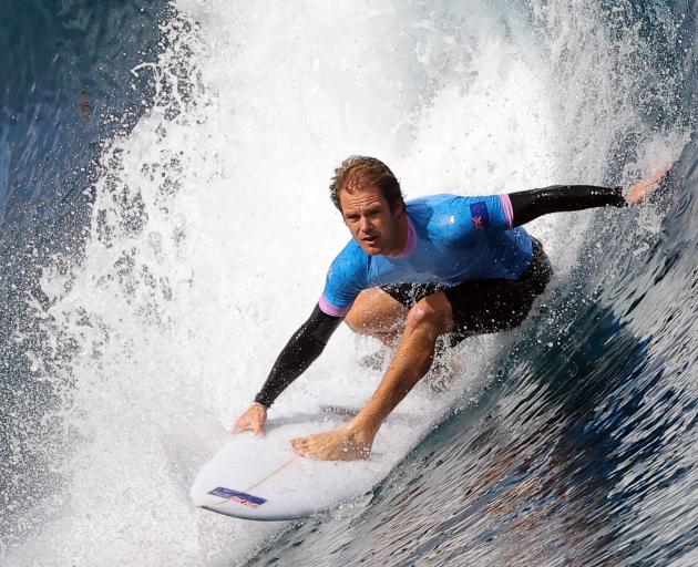 Billy Stairmand, of New Zealand, in action during his surfing heat in Teahupo'o, Tahiti, French...