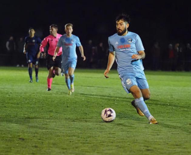 Coastal Spirit striker Alex Steinwascher weighs up his options against Ferrymead Bays. PHOTO: JIM...