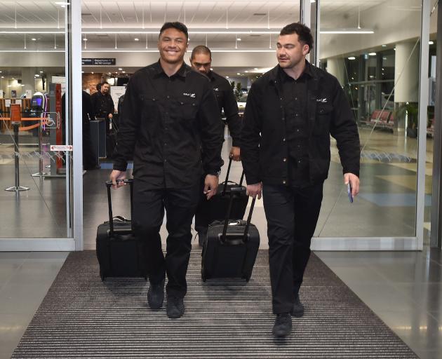 Team-mates Caleb Clarke (left) and David Havili, leave the Dunedin Airport terminal last night.