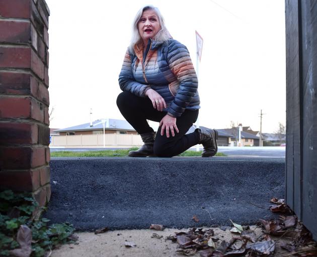 A raised footpath outside Bridgette Beckingham’s property in Argyle St, Mosgiel, may have to be...