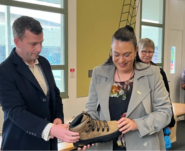 Acting Prime Minister David Seymour and Minister for Children Karen Chhour look at the type of...