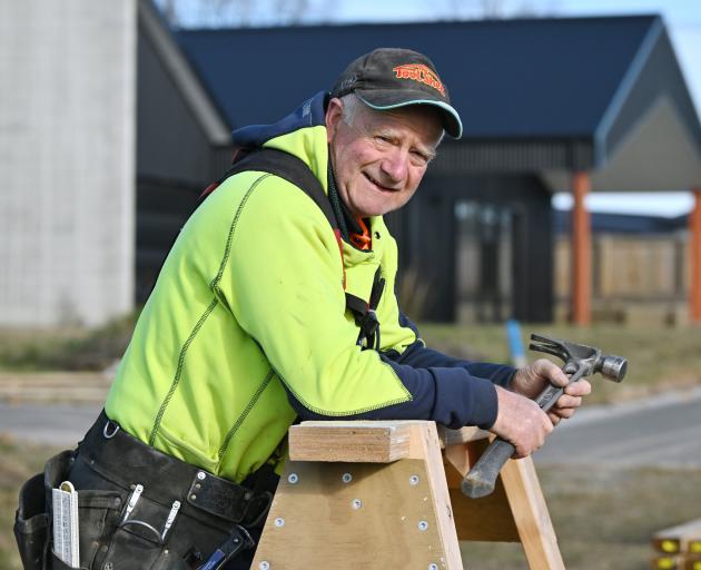 Marcus Brown on the tools at a building site at Weston yesterday. PHOTO: GERARD O’BRIEN