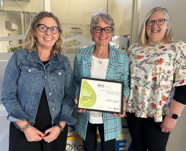 Central Otago Reap manager Bernie Lepper (centre) insists her ACE Aotearoa Leader of the Year —...