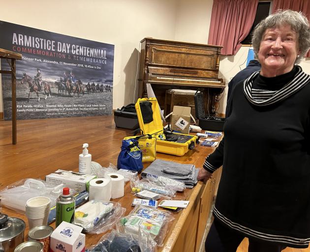 Roxburgh resident Margaret Card checks out the emergency kit items at a meeting in Roxburgh...