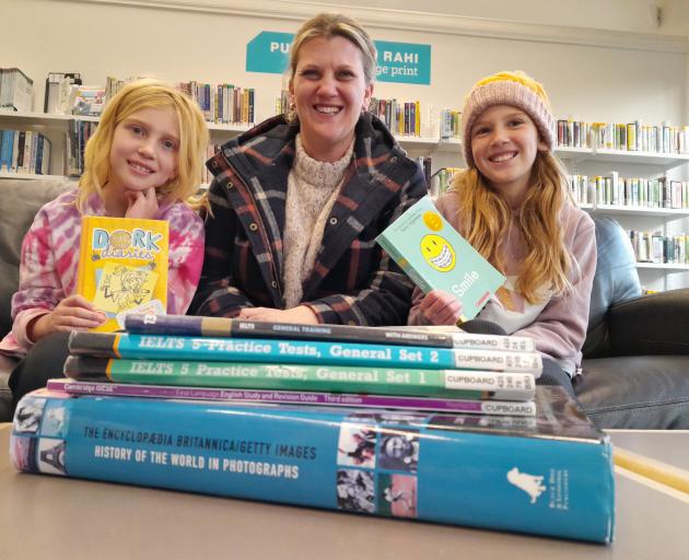 English as Second Language teacher Jo Hewson-Williams, centre, with her daughters Lola (8, right)...