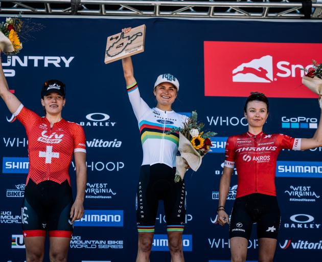 Sammie Maxwell celebrates atop the podium at the UCI Mountain Bike World Champs, Snowshoe Cross...