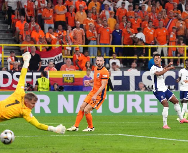 Ollie Watkins watches as his last minute shot goes past Dutch keeper Verbruggen to send England...