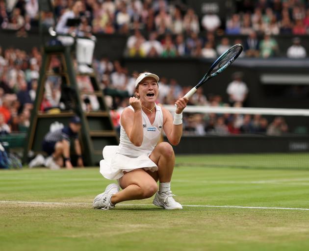 Sun celebrates beating Emma Raducanu, of Great Britain, to make the Wimbledon quarterfinals at...