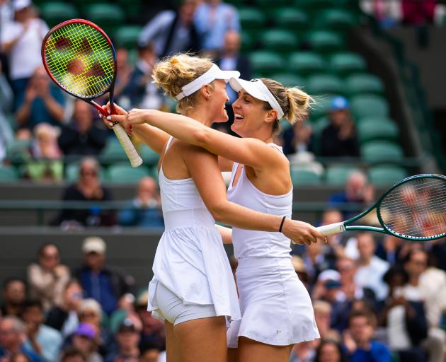 New Zealander Erin Routliffe (left) and Canadian Gabriela Dabrowski celebrate after winning their...