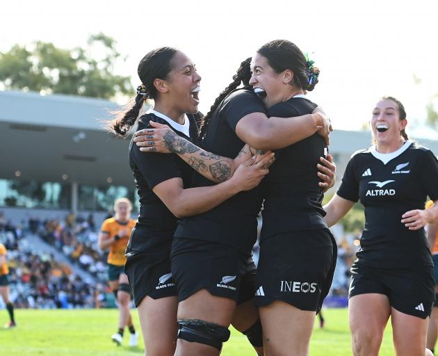 Katelyn Vahaakolo of the Black Ferns celebrates with team mates after scoring a try during the...