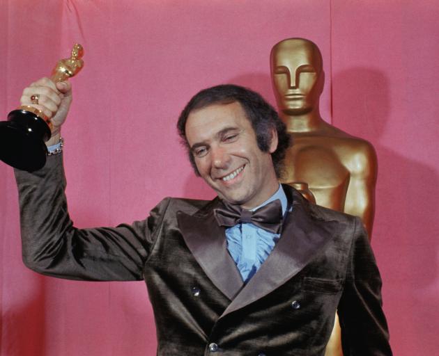 Producer of The Godfather, Albert S. Ruddy, holds his Oscar after winning the Oscar for Best...